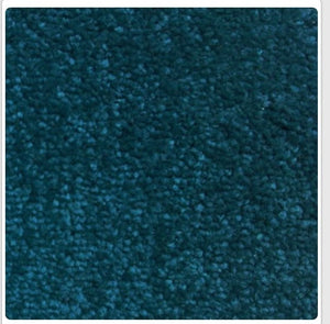 A close-up texture shot of a dark teal blue carpet or fabric swatch, framed with a thin white border.
