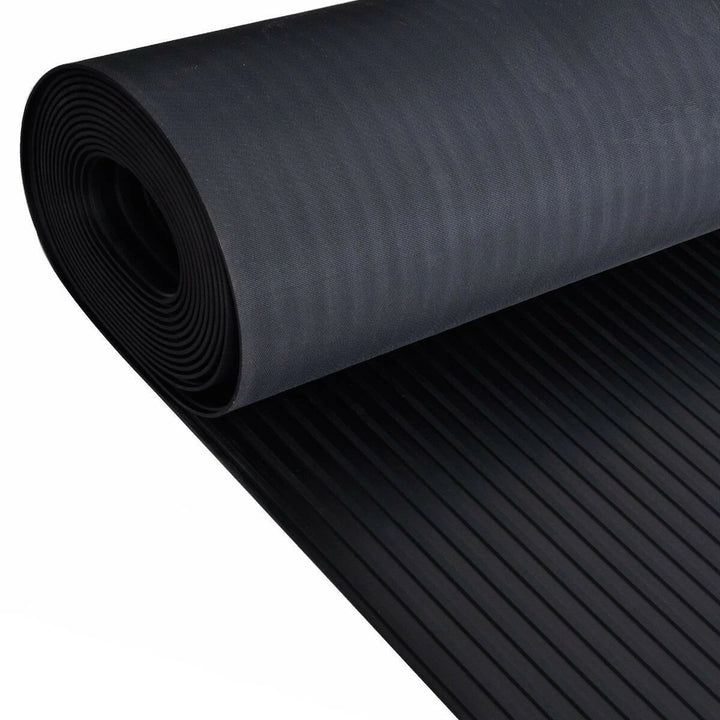 Roll of black rubber matting on a white background