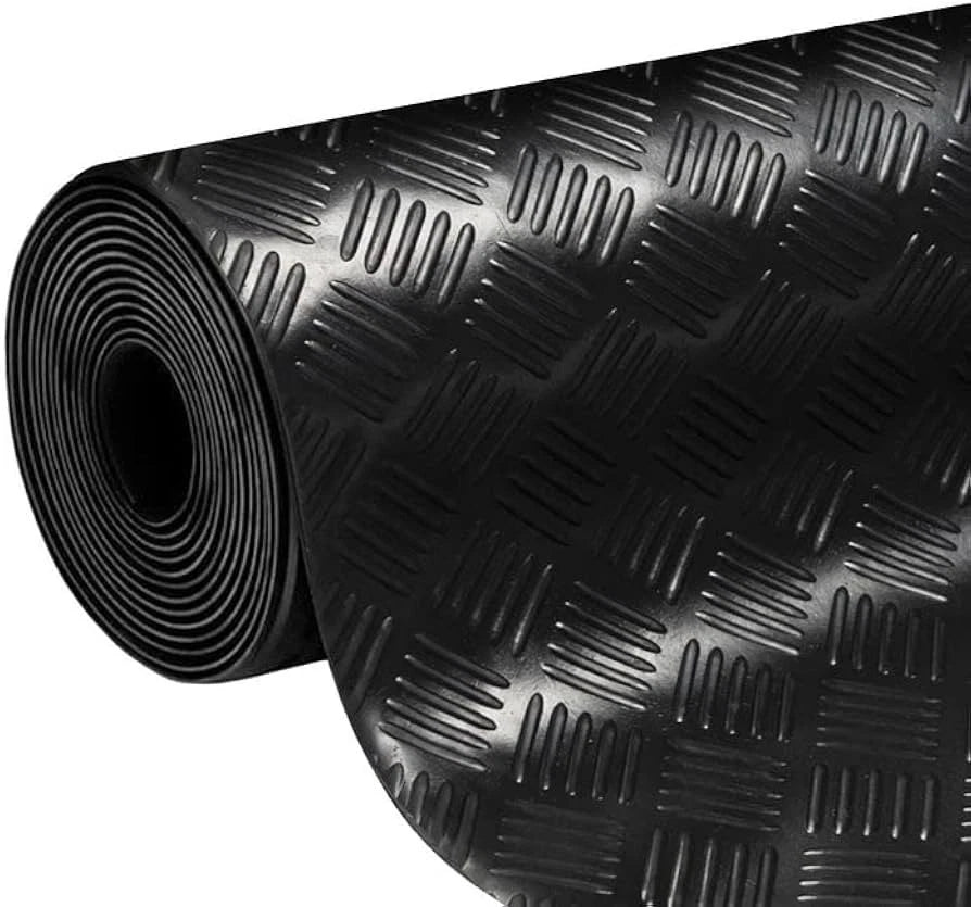 Roll of black textured rubber matting on a white background