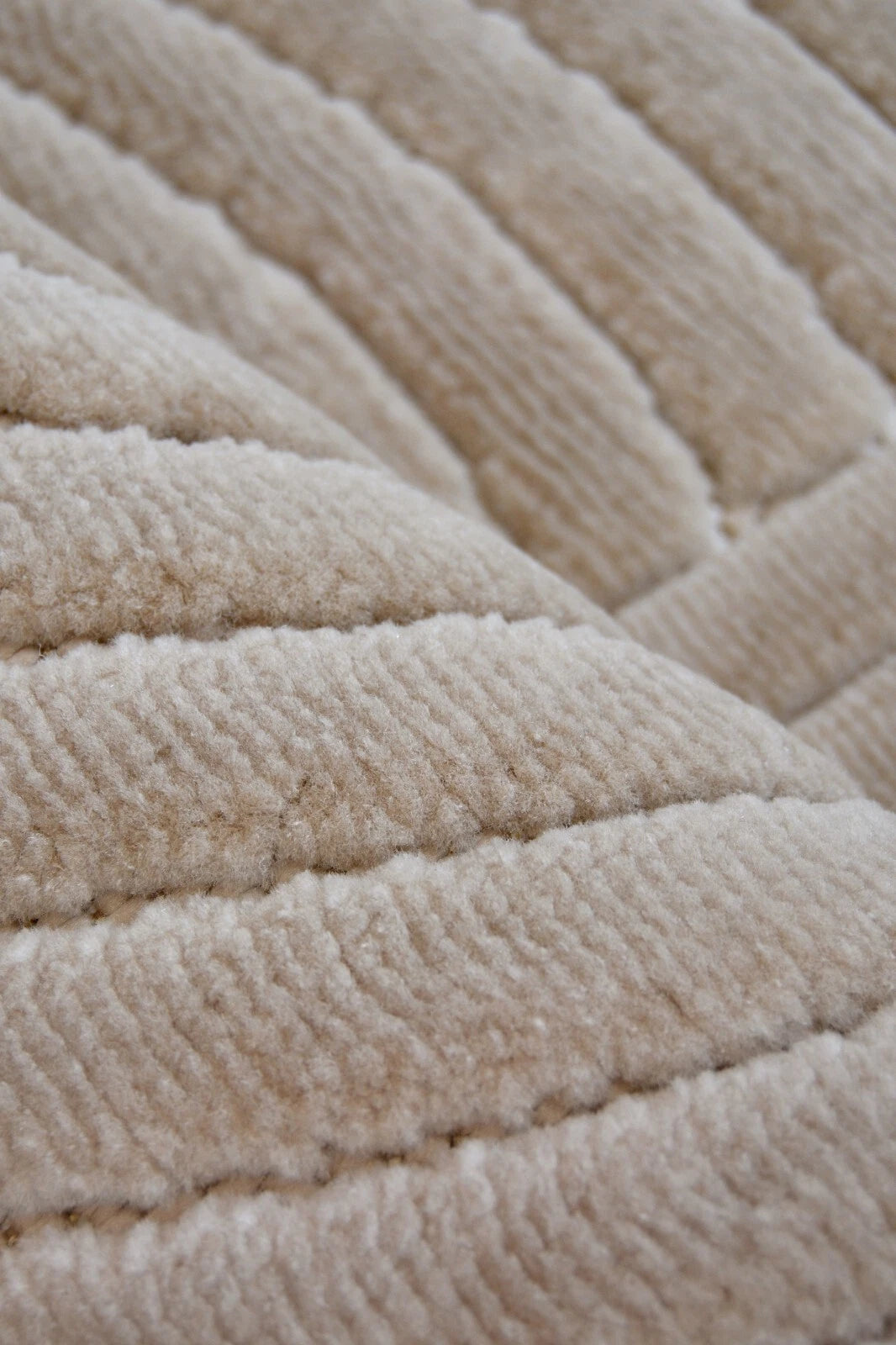 Close-up of a textured beige carpet