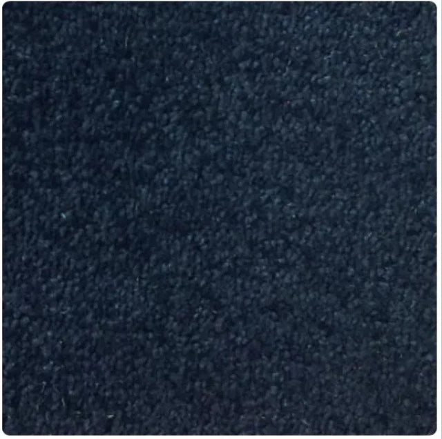 A close-up texture swatch of dark navy blue carpet or fabric with a short pile surface.