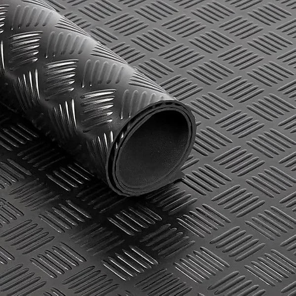 Roll of black textured rubber matting on a matching background