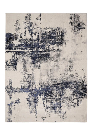 Abstract patterned rug with blue and gray design on a white background