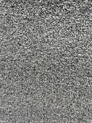 A close-up texture shot of a gray and white melange carpet or fabric, showing a dense, short-pile looped texture.