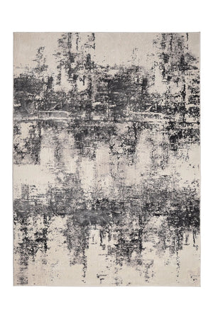 Abstract patterned rug with black and gray tones on a white background