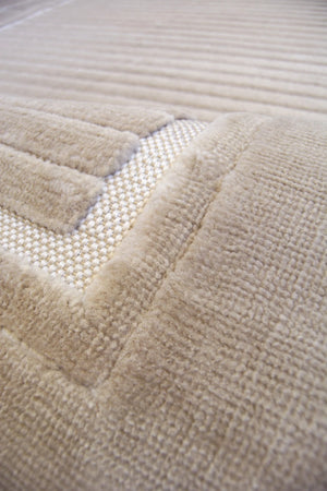 Close-up of a textured beige fabric surface