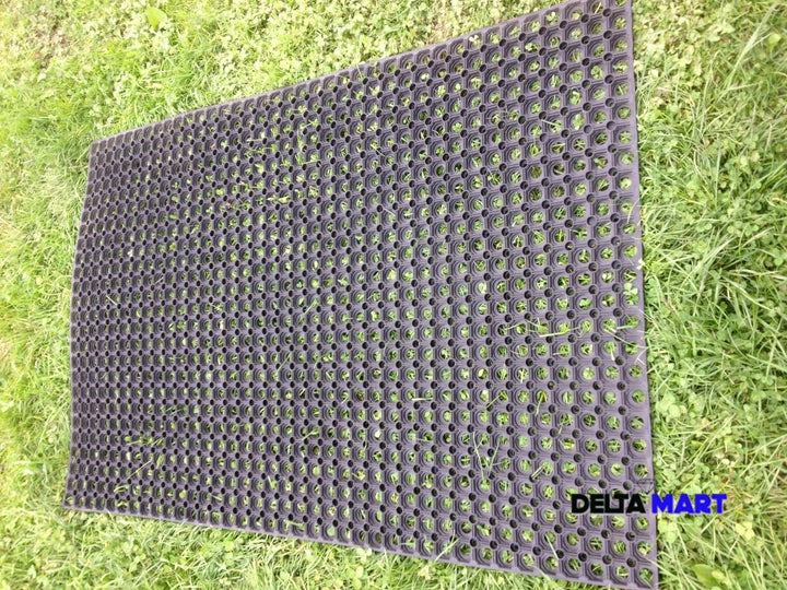 Textured mat on grass with 'Delta Mart' branding