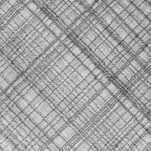 A close-up of a gray and white textured fabric with a subtle plaid pattern.