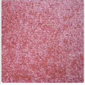 A close-up texture swatch of a pinkish-red, granular material with a fine, sandy, or pebbled surface.