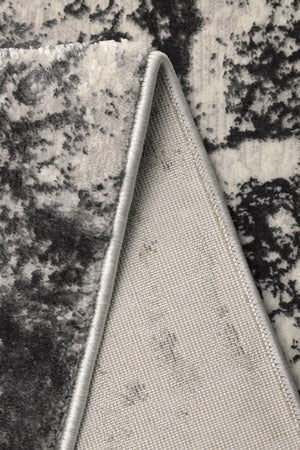 Close-up of a textured fabric triangle on a granite surface