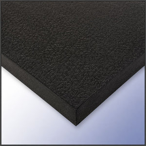 A close-up of a black textured foam board or panel, showing its rough fibrous surface and angled edges against a light blue-to-white gradient background.