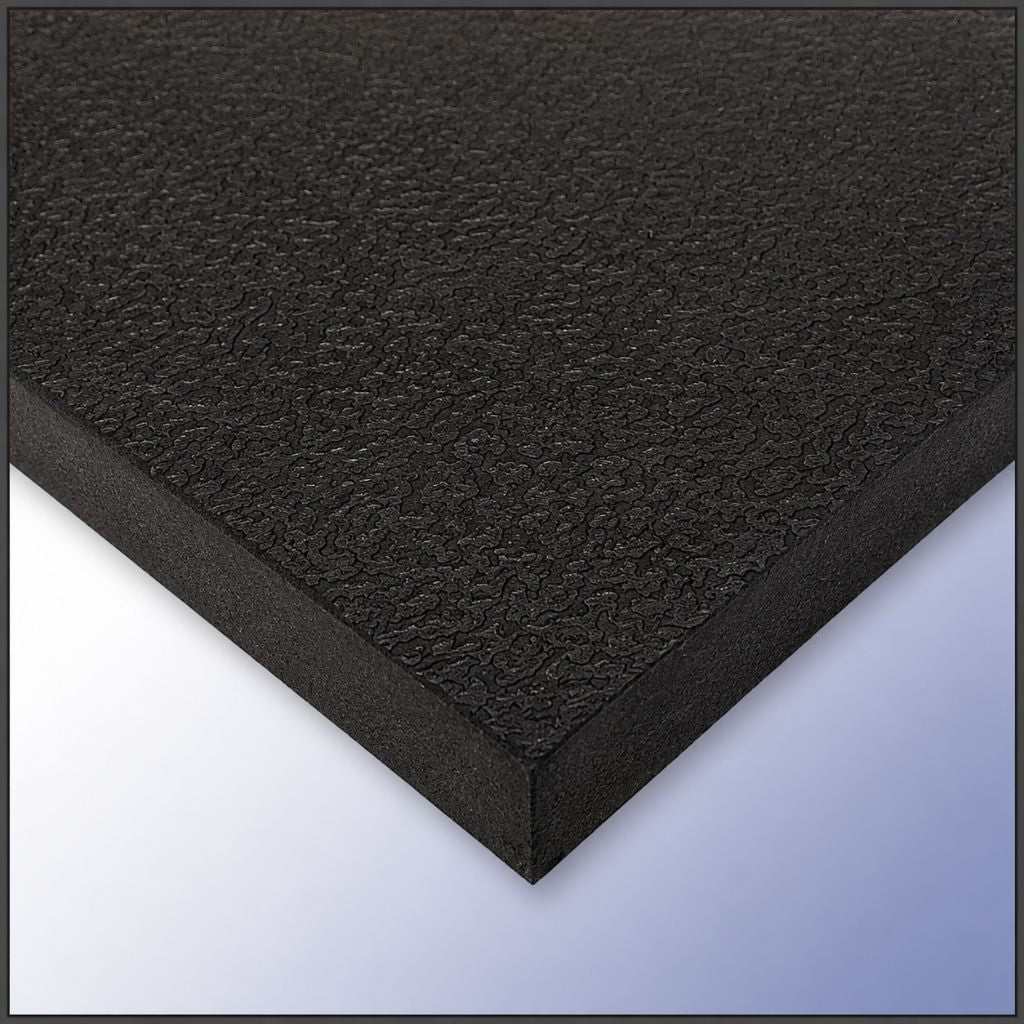 A close-up of a black textured foam board or panel, showing its rough fibrous surface and angled edges against a light blue-to-white gradient background.