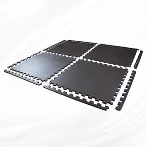 Exploded layout view of four black interlocking foam gym mat tiles with matching edge borders.
