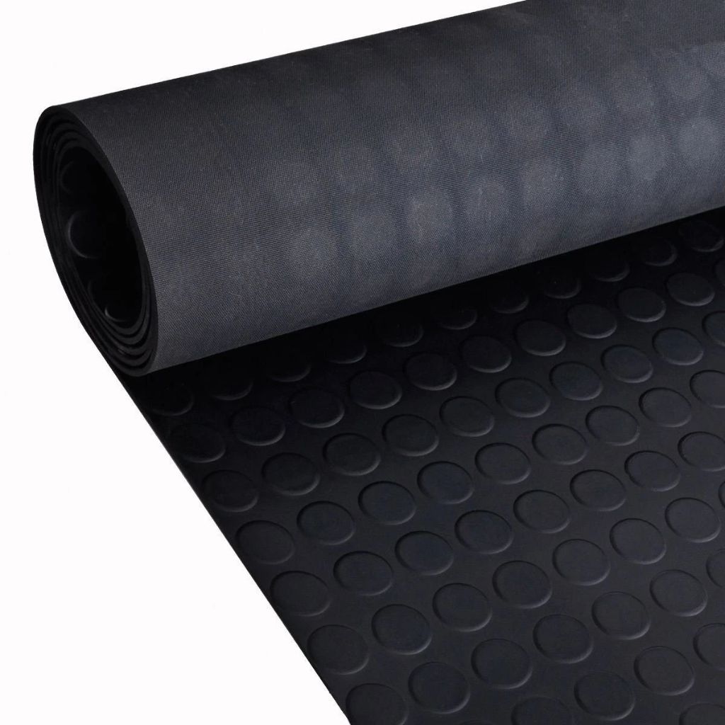 High-angle view of a partially unrolled 3mm thick black coin pattern rubber flooring matting roll.
