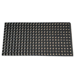 Full overhead view of a 1.5M x 1M black rubber grass mat with a hollow drainage ring design.