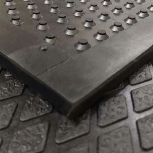 Profile view highlighting the 16mm thickness and textured non-slip diamond pattern of a luxury horse stable mat.