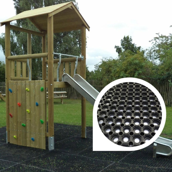 Wooden playground structure with slide and inset of rubber mat texture