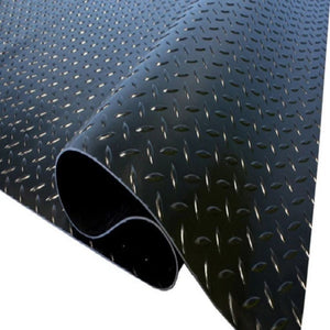 Textured black and gray surface with a metal rod
