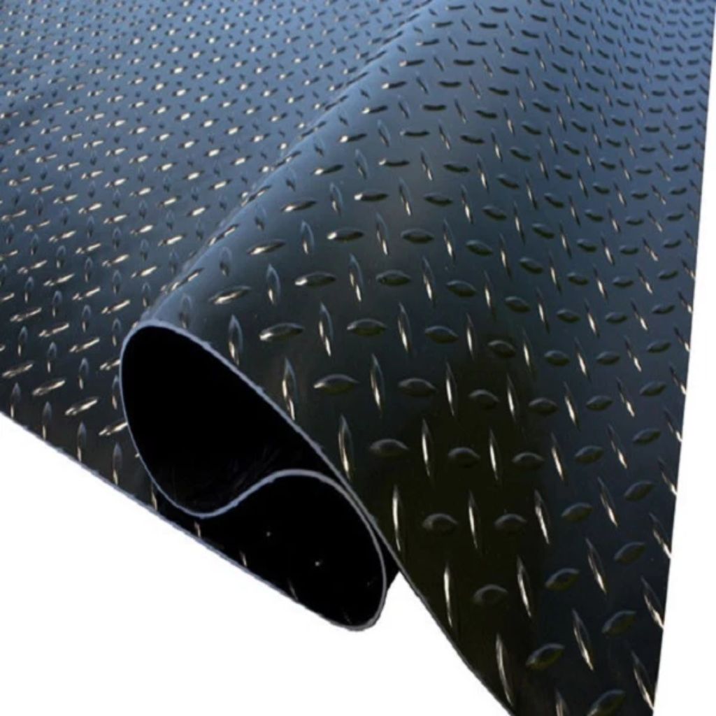 Textured black and gray surface with a metal rod
