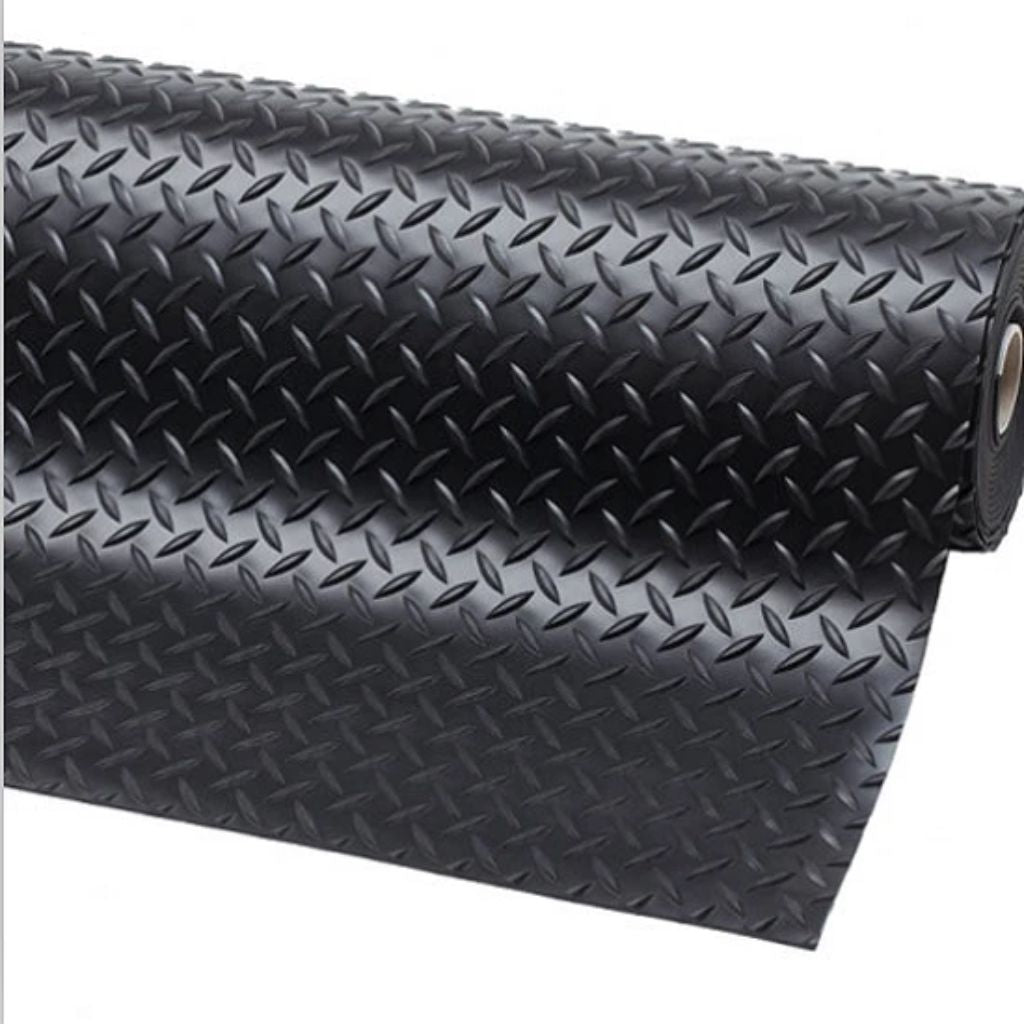 A black diamond plate textured mat, partially rolled up, shown on a plain white background.