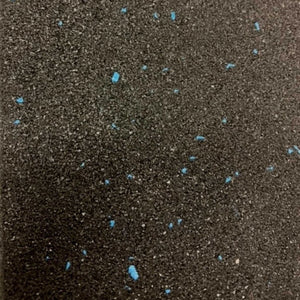 A close-up of a dark charcoal or black textured surface with scattered small bright blue flecks or inclusions.