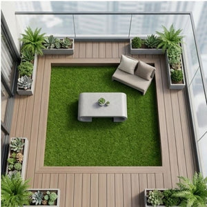 Modern balcony terrace featuring a 20mm artificial grass square area with patio furniture and potted plants.
